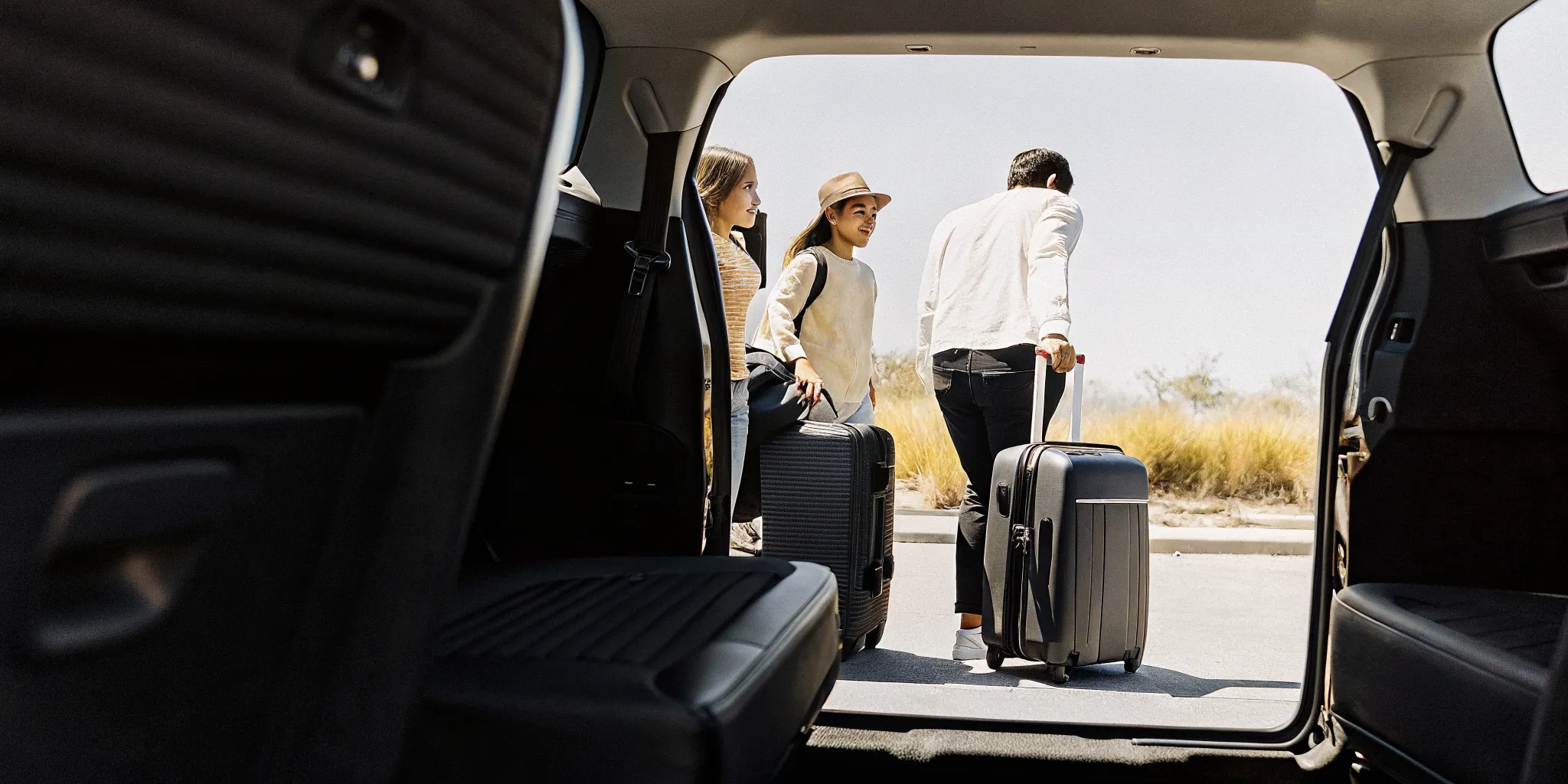 Family with kids boarding a private van shuttle at LAX airport for Disneyland trip