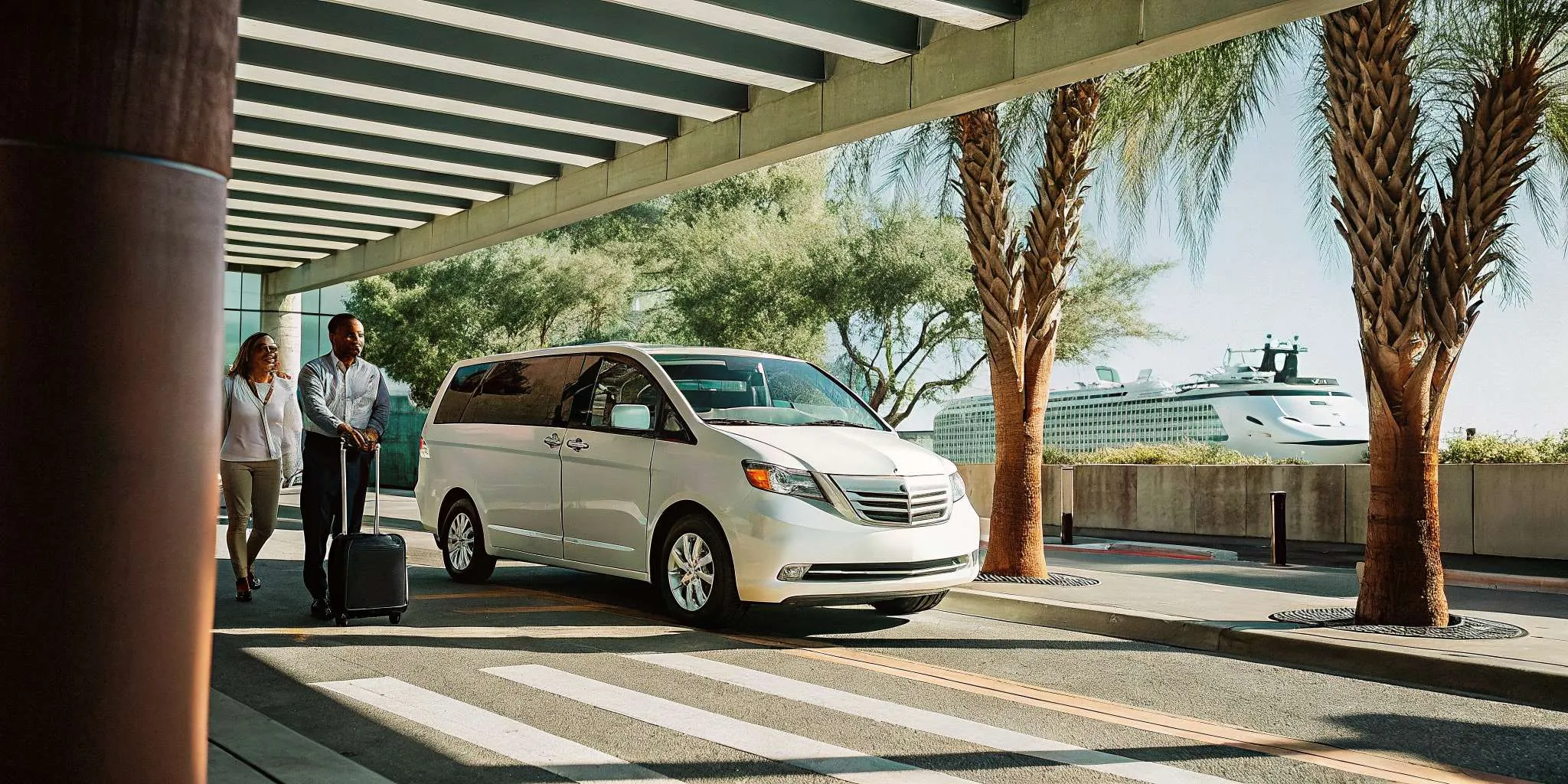 Private van shuttle at Long Beach cruise terminal with cruise ship in background