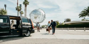 Private shuttle van outside Universal Studios Hollywood entrance ready for LAX return trip