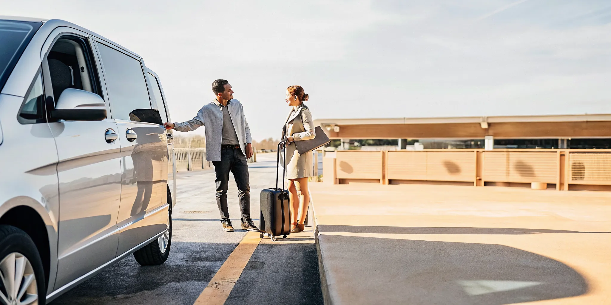 First-time travelers meeting a private van driver for LAX airport pickup